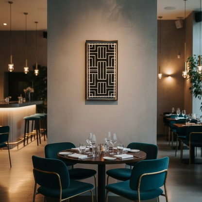 Modern restaurant interior with tables, chairs, and black and cream textile wall art.