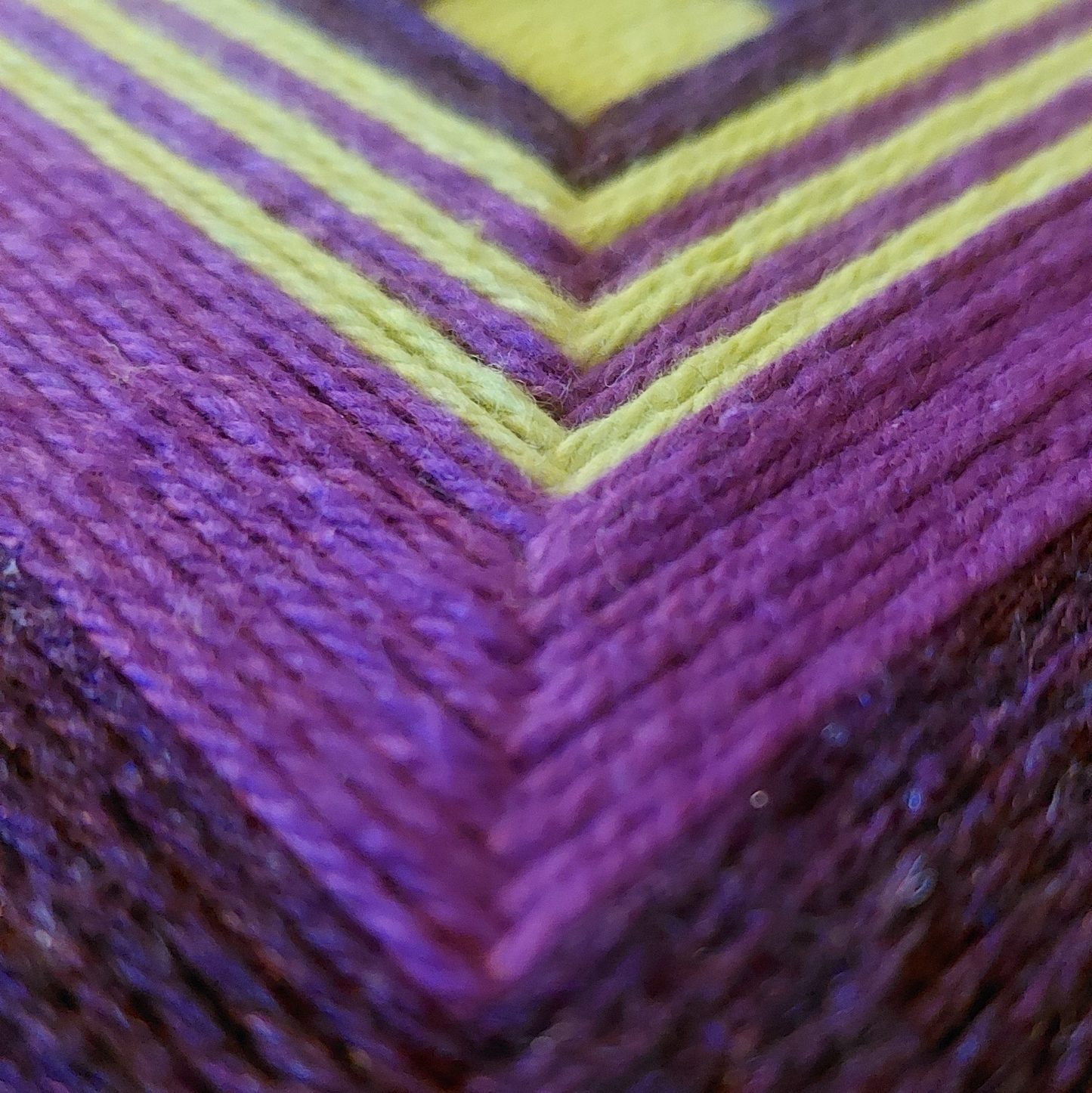 Textile art, in purples and chartreuse. 