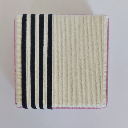 Square artwork with black stripes, pink edges on a light gray background